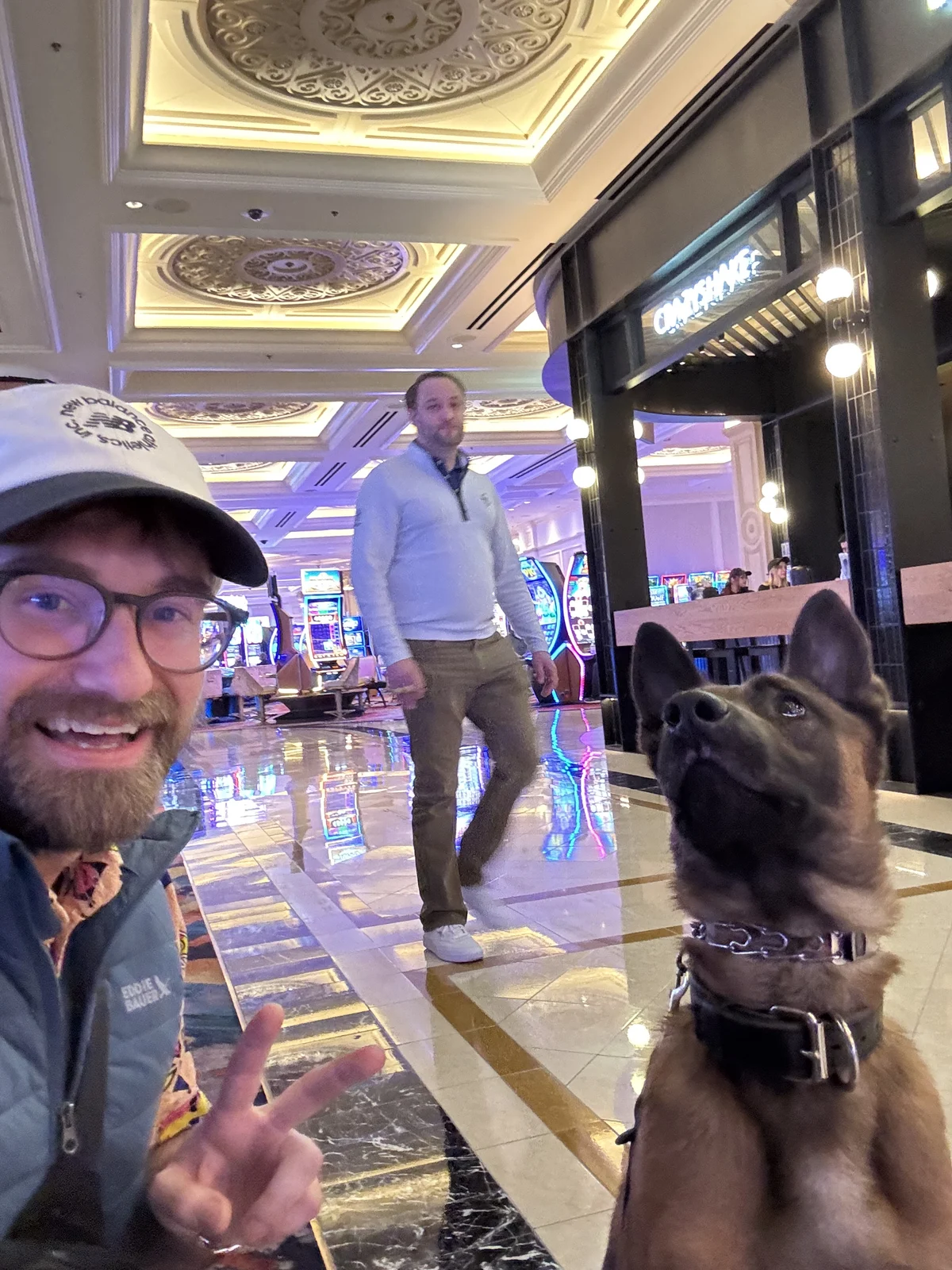 Mitchell and a working dog practicing in a busy indoor public setting